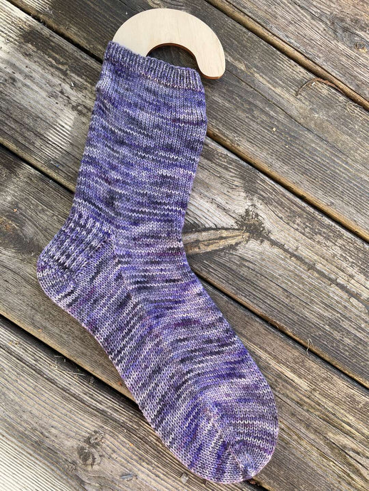Vanilla socks knitted in merino sock purple rain.